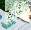 Businesswomen use a digital tablet to analyze ESG design.